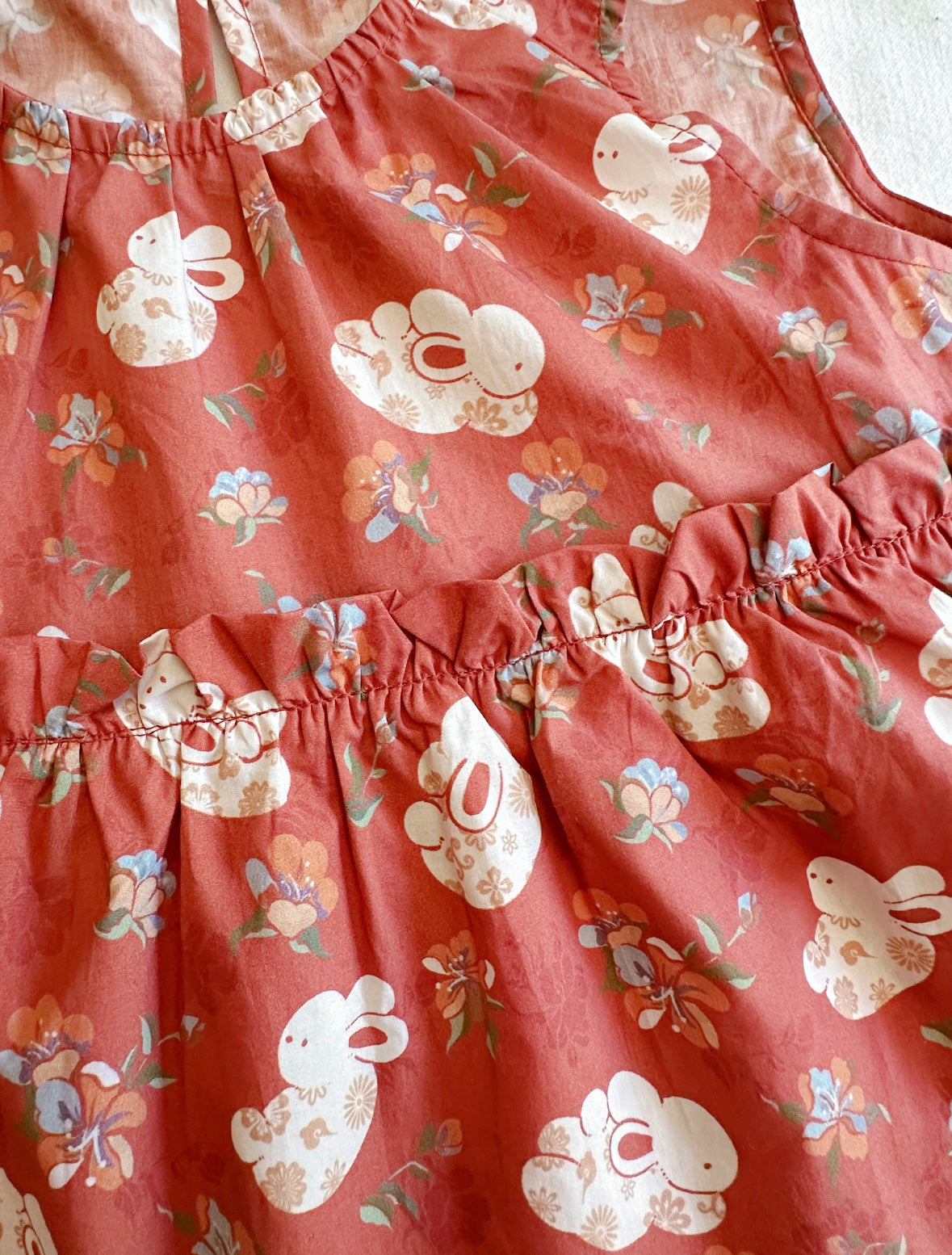 Tangerine Bunny Peplum Top